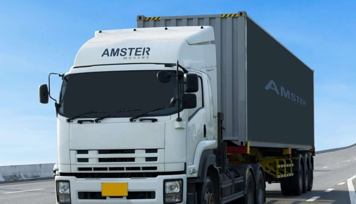 amster movers no.1 reliable packers and movers in dubai truck on road