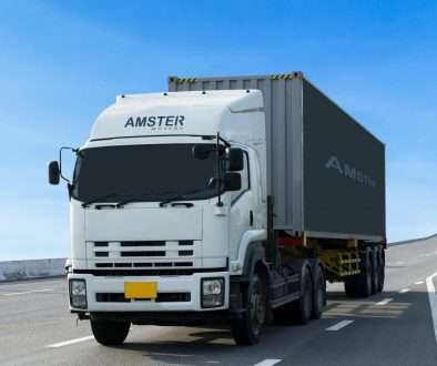 amster movers no.1 reliable packers and movers in dubai truck on road